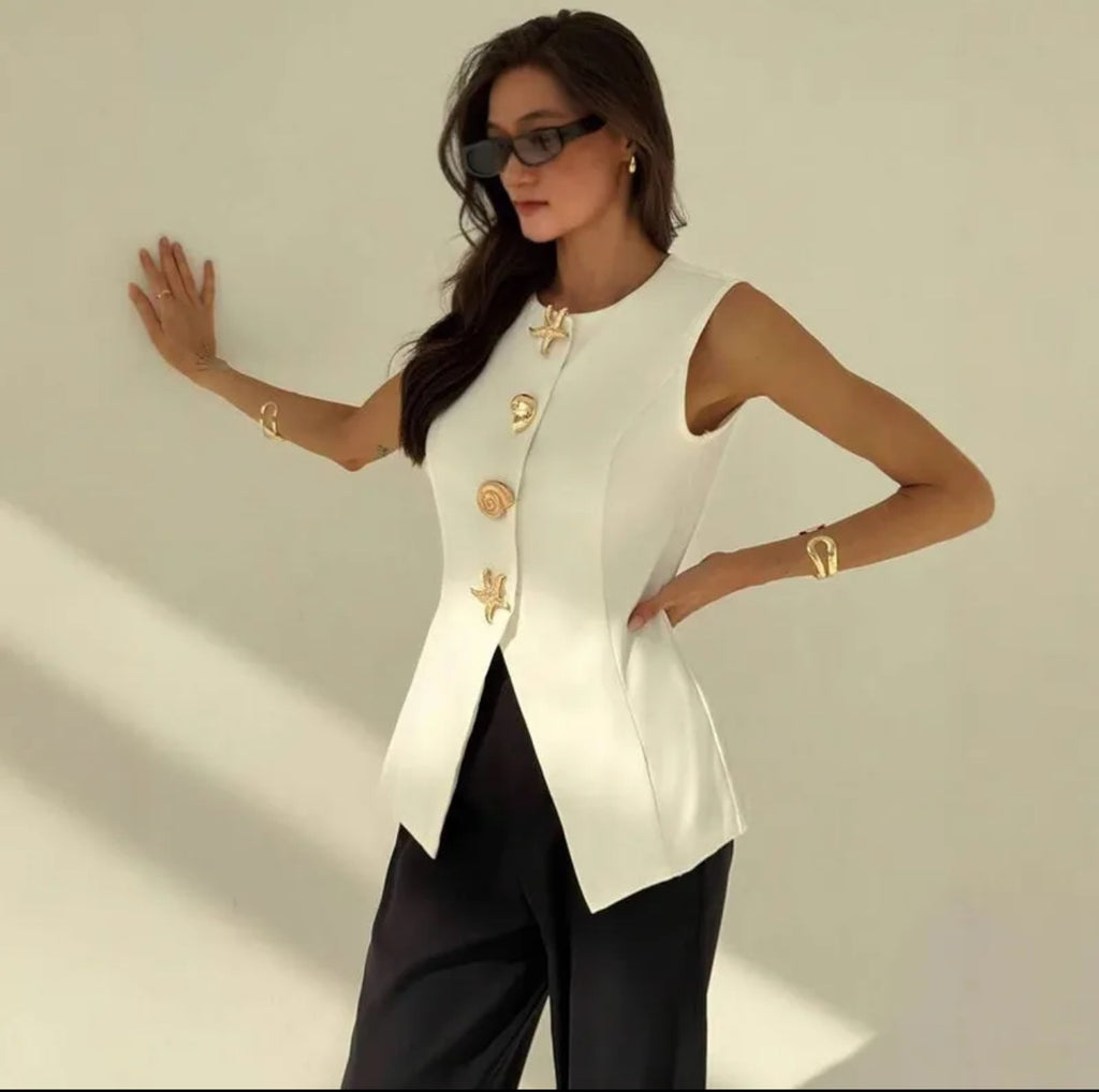 Blusa con punts isometrics & botones dorados con motivos Marinos